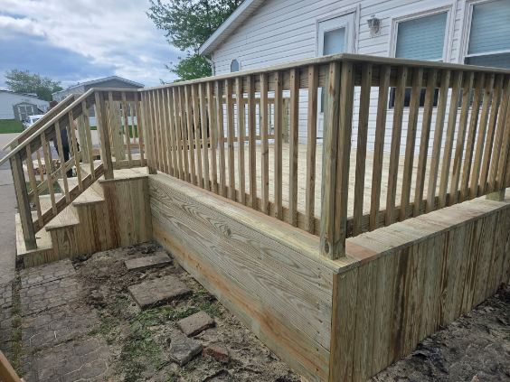 New pressure treated wood deck with skirting and railing built by T&J Construction