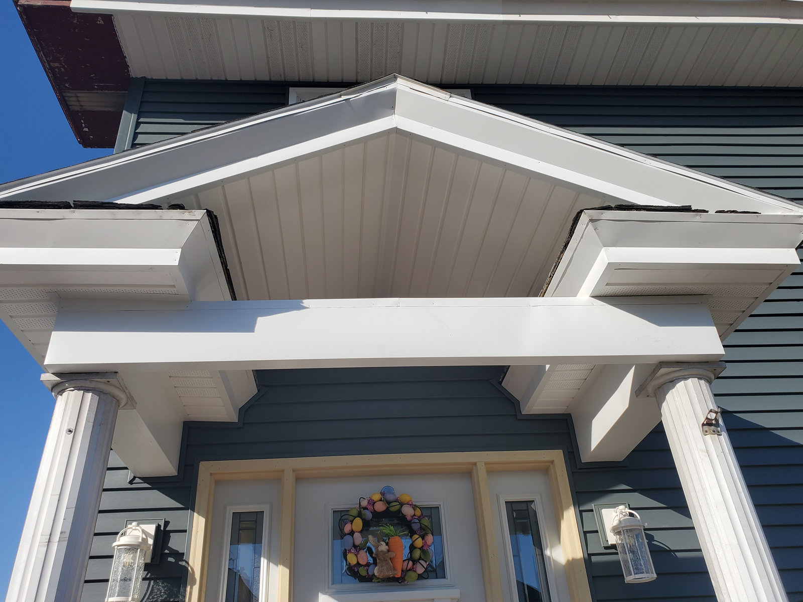 Craftsman style front porch portico with columns and wood accents