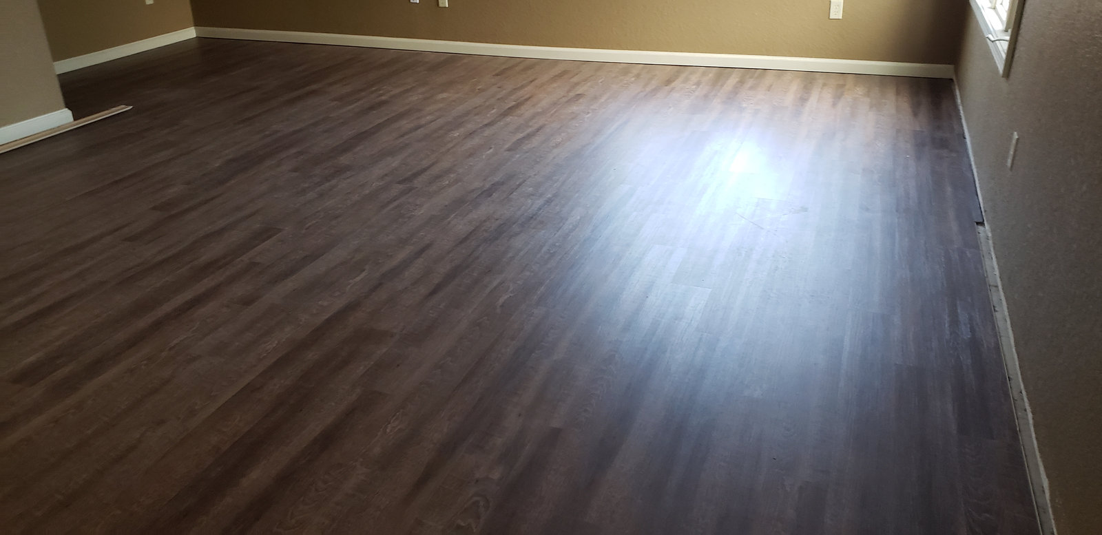 New wood look flooring and fresh trim from a home remodeling project